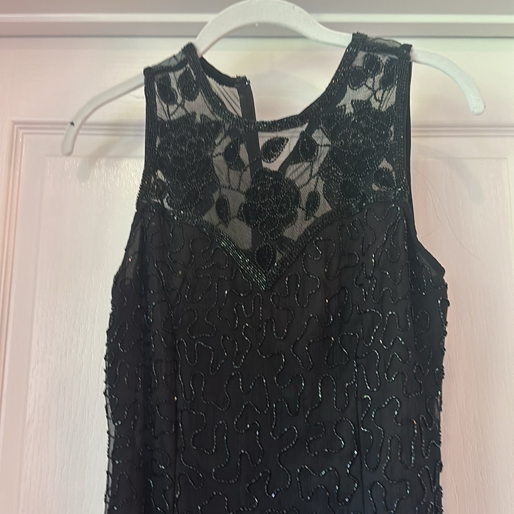 Brilliante black full length formal dress with beads.